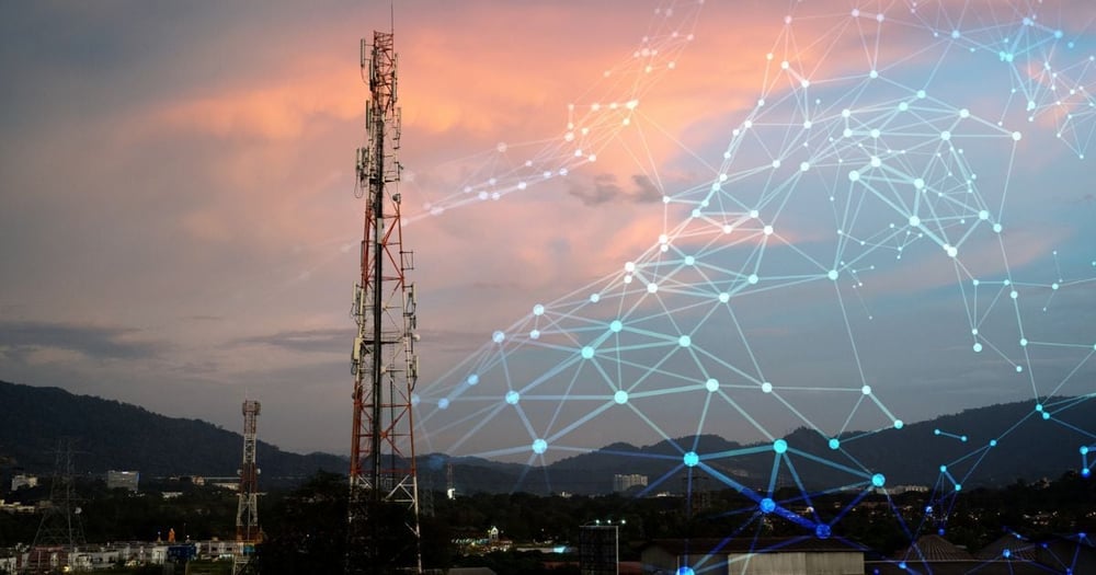sunset cloudy sky with a mobile tower in front and light up lines connecting dots